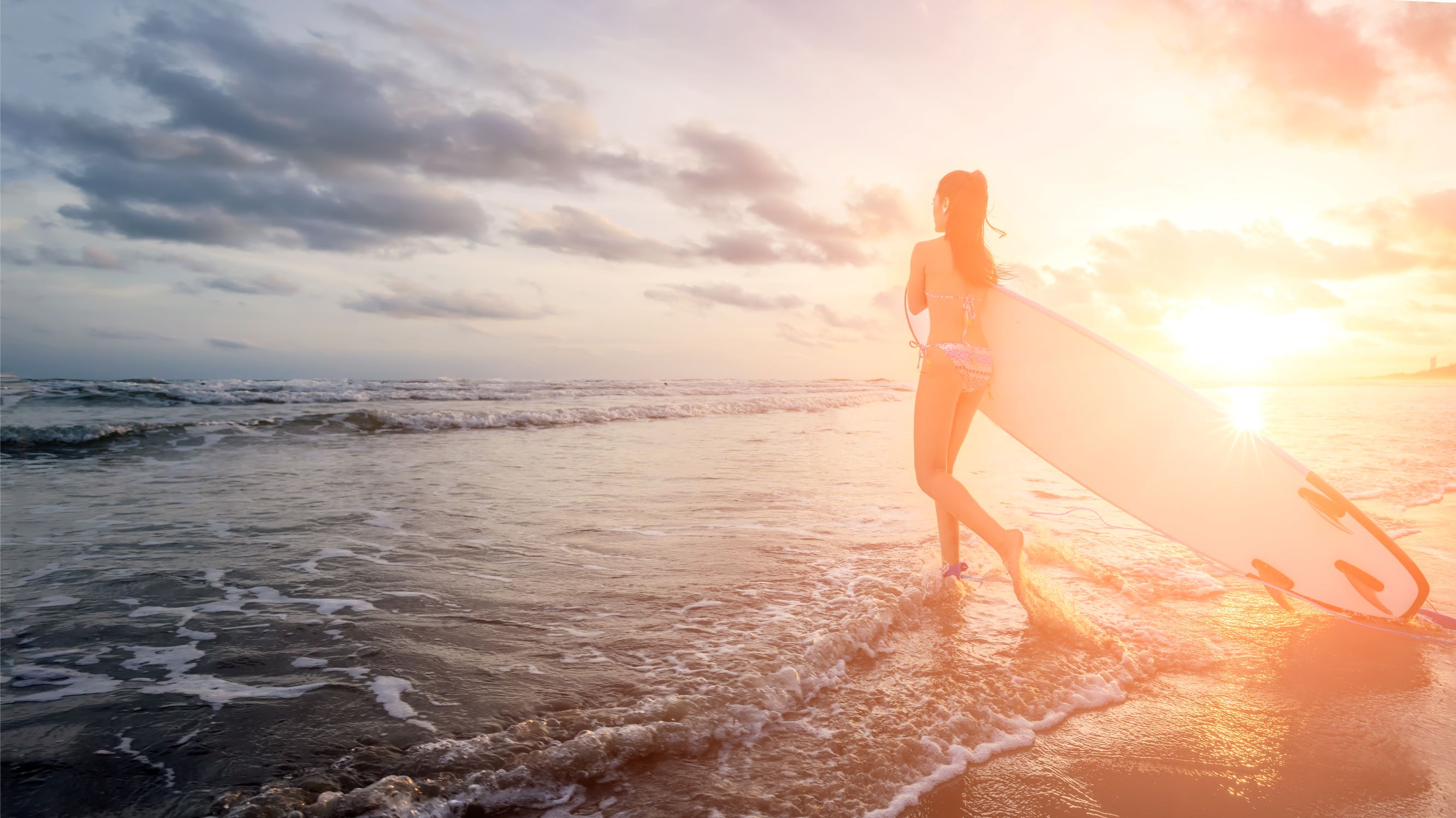 girl surfer at sunset 1184413208 small.jpg